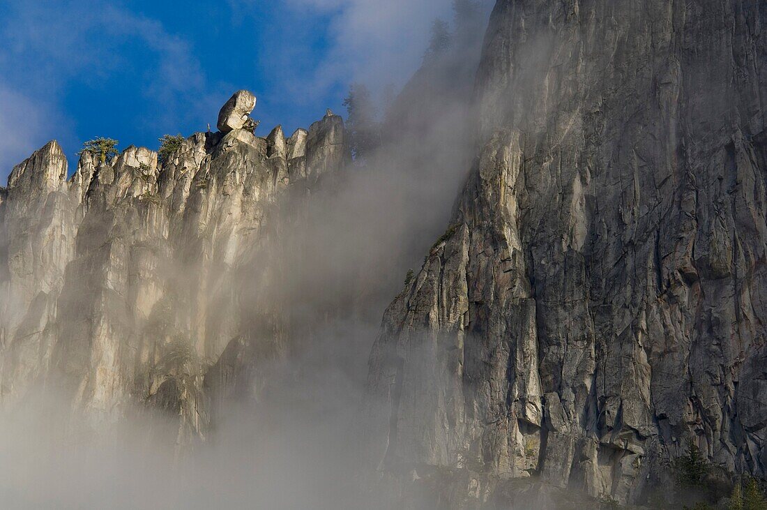 Clouds and sheer granite clif walls above Yosemite Valley, Yosemite National Park, California