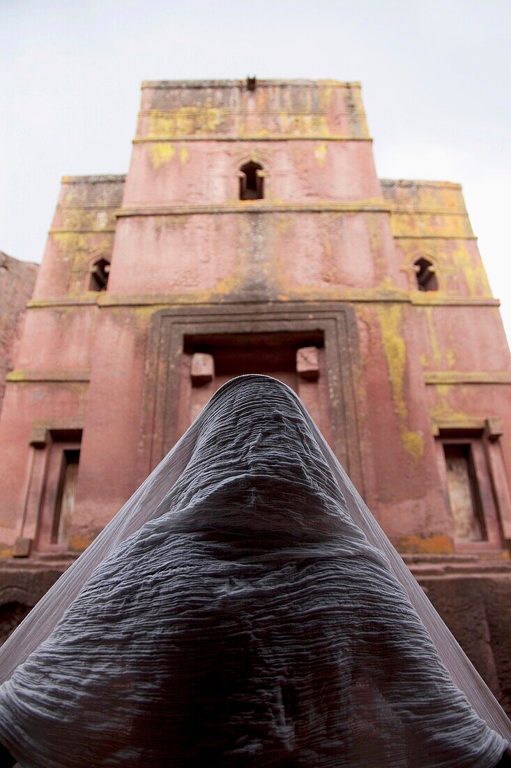 Africa. Ethiopia. Lalibela. Pilgrim in St George rock carved church.