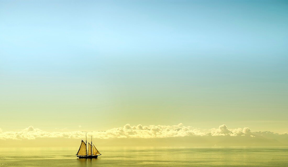 sailing ship with blue sky and clouds