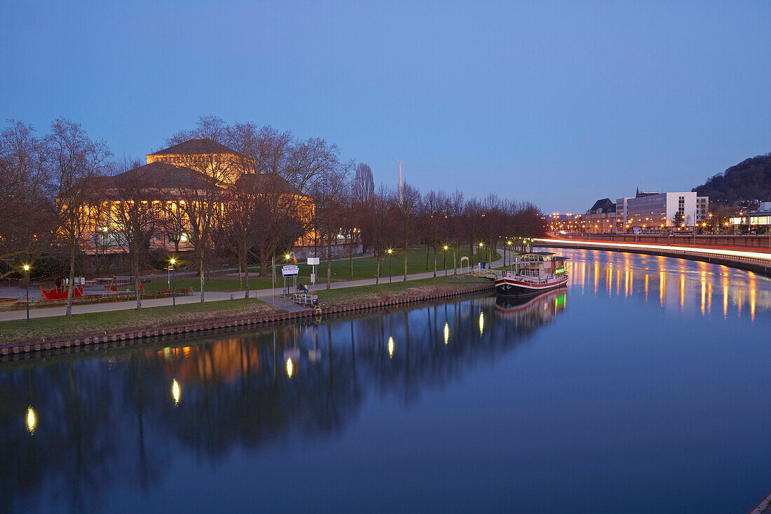 View over the river Saar onto the theater in the evening, Saarbruecken, Saarland, Germany, Europe