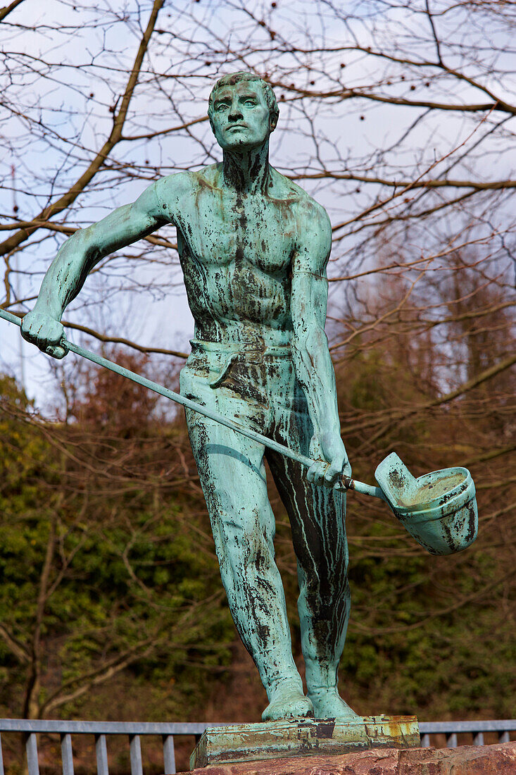 Sculpture of an iron-founder at Saarbruecken Brebach, Saarland, Germany, Europe