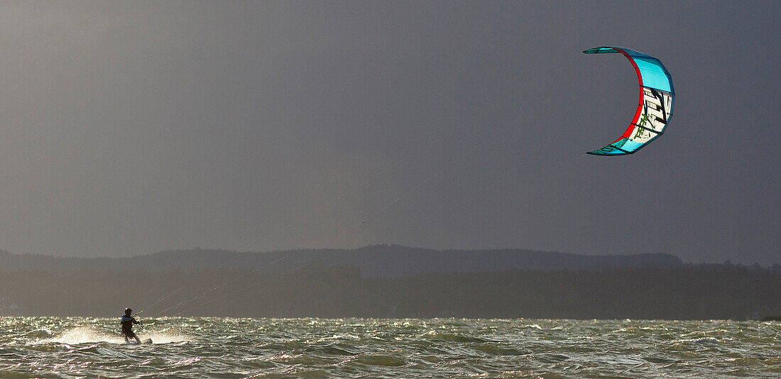 Kitesurfer at lake Chiemsee, Chieming, Chiemgau, Upper Bavaria, Germany