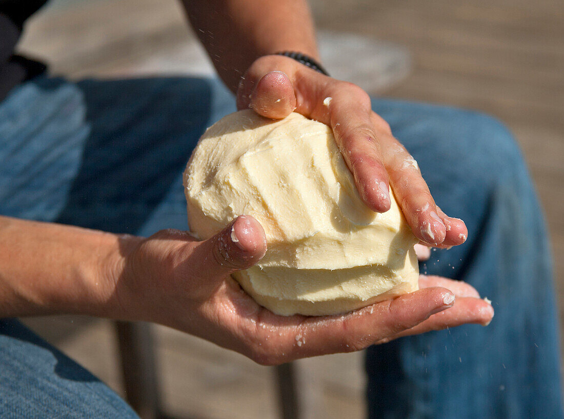 Man froming butter, Hofbauern-Alm, Kampenwand, Chiemgau, Upper Bavaria, Germany