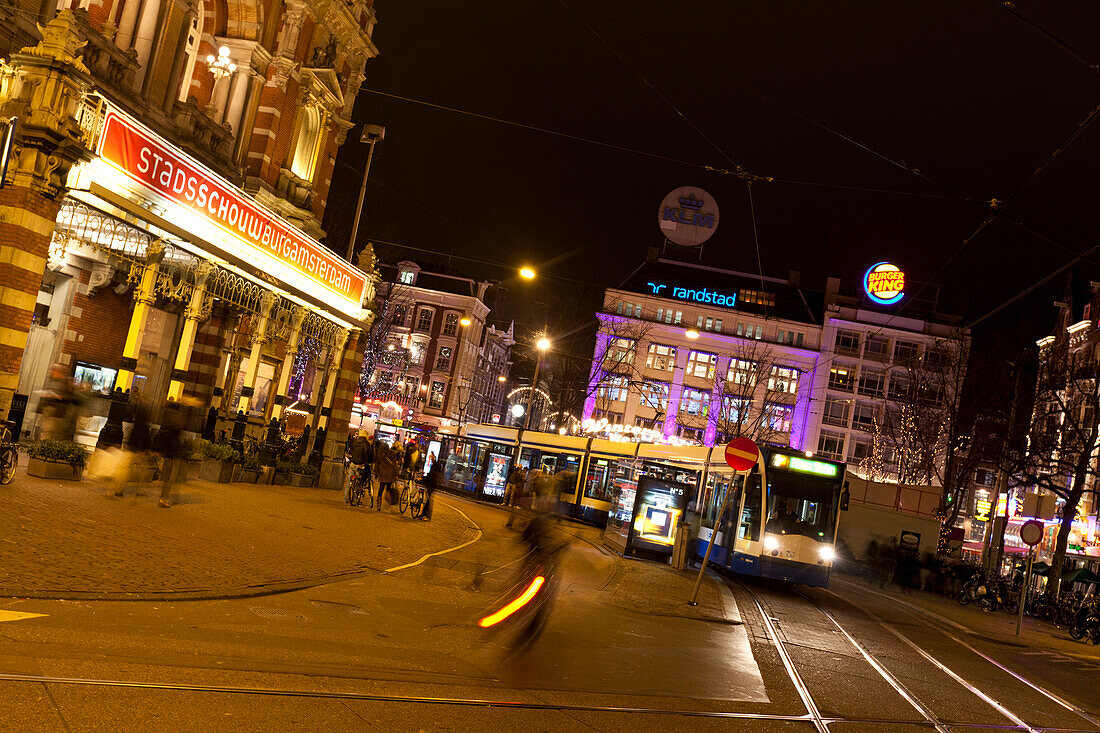 Trams in front of Stadsschouwburg theater on Leidseplein, Amsterdam, Netherlands