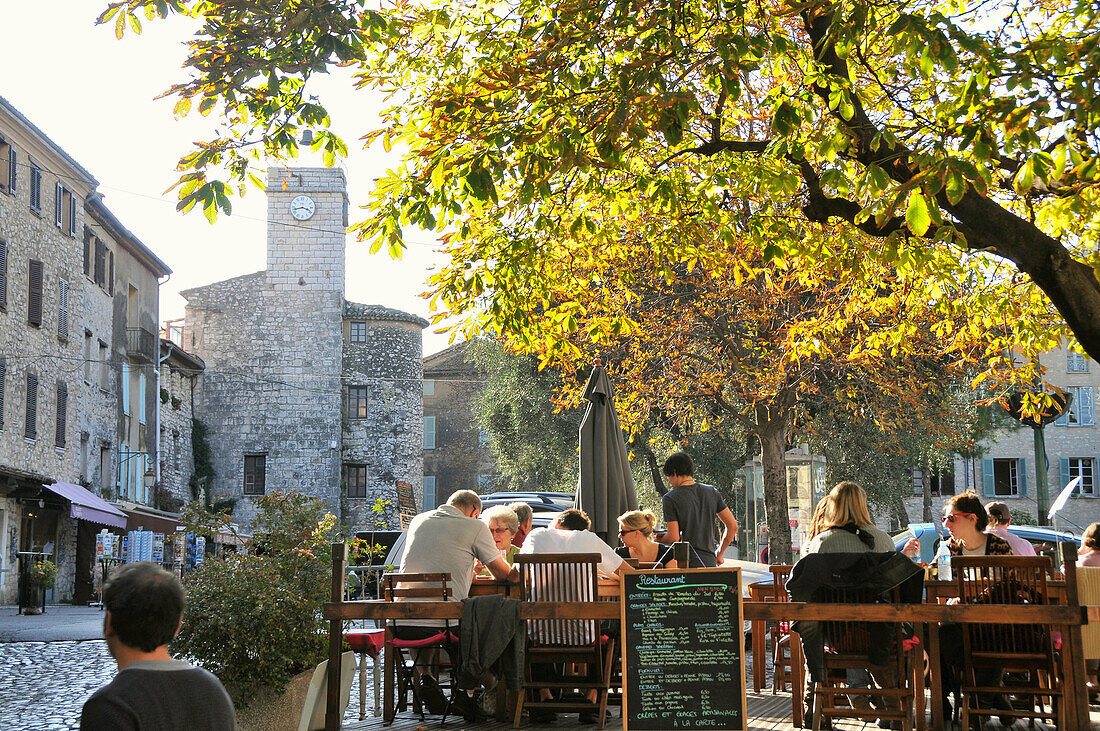 Restaurant on a square at mountain village Tourrettes sur Loup, Cote d'Azur, South France, Europe