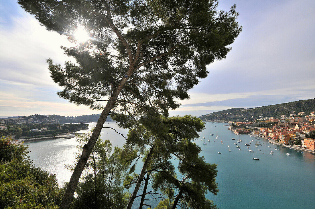 View of Villefranche-sur-Mer and Cap Ferrat under clouded sky, Cote d'Azur, South France, Europe