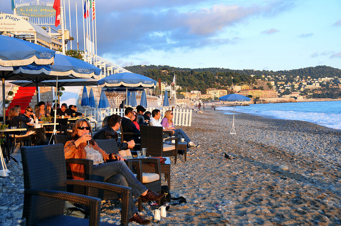 People at a beach bar at the Promenade des Anglais, Nice, Cote d'Azur, South France, Europe