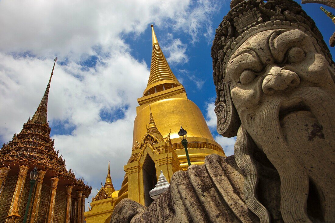 Chinese warrior statue with golden chedi  Wat Phra Kaew Emerald Buddha Temple and Grand Palace  Bangkok, Thailand, Southeast Asia, Asia