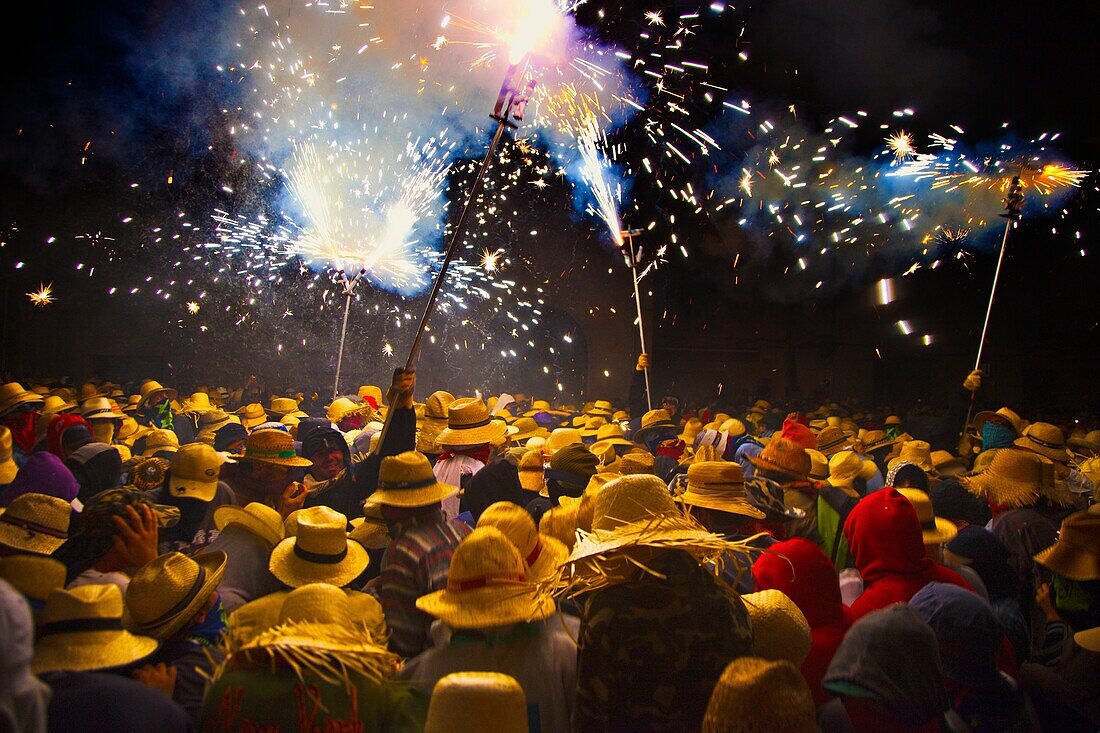 Correfoc  Catalan traditional festival 16th August where people dressed as devils light fireworks while dancing in the street, La Bisbal d Emporda, Baix Emporda, Costa Brava, Girona province, Catalonia, Spain