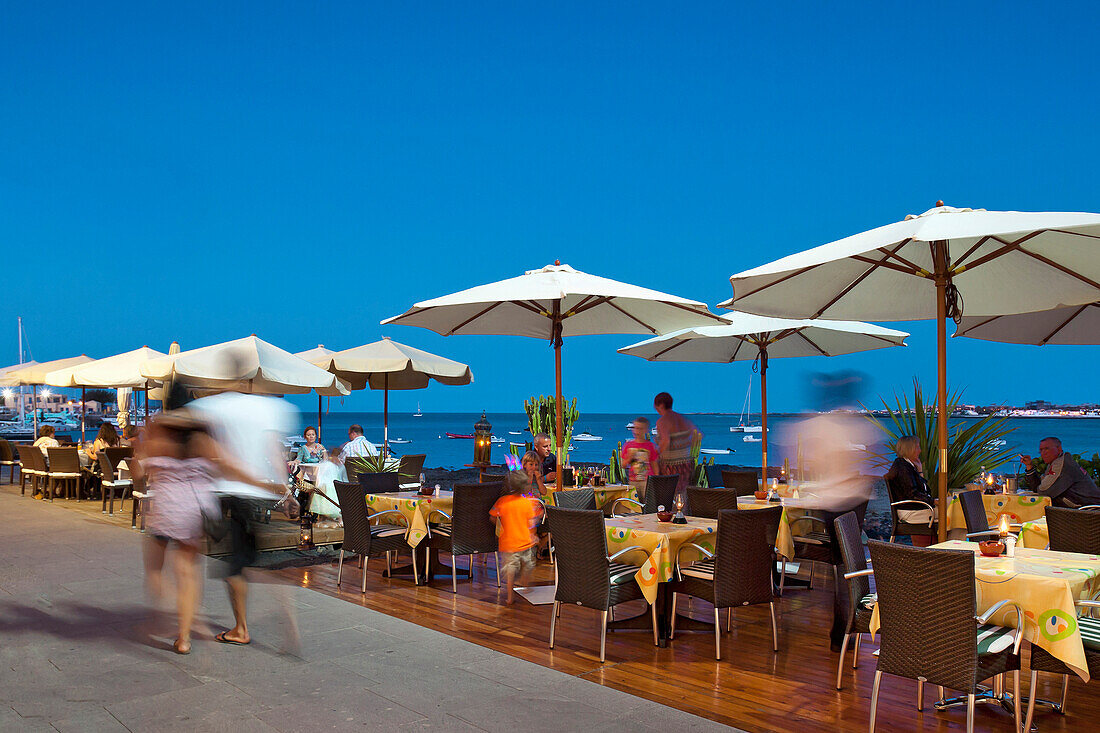 Restaurant on the seaside promenade at dusk, Corralejo, Fuerteventura, Canary Islands, Spain