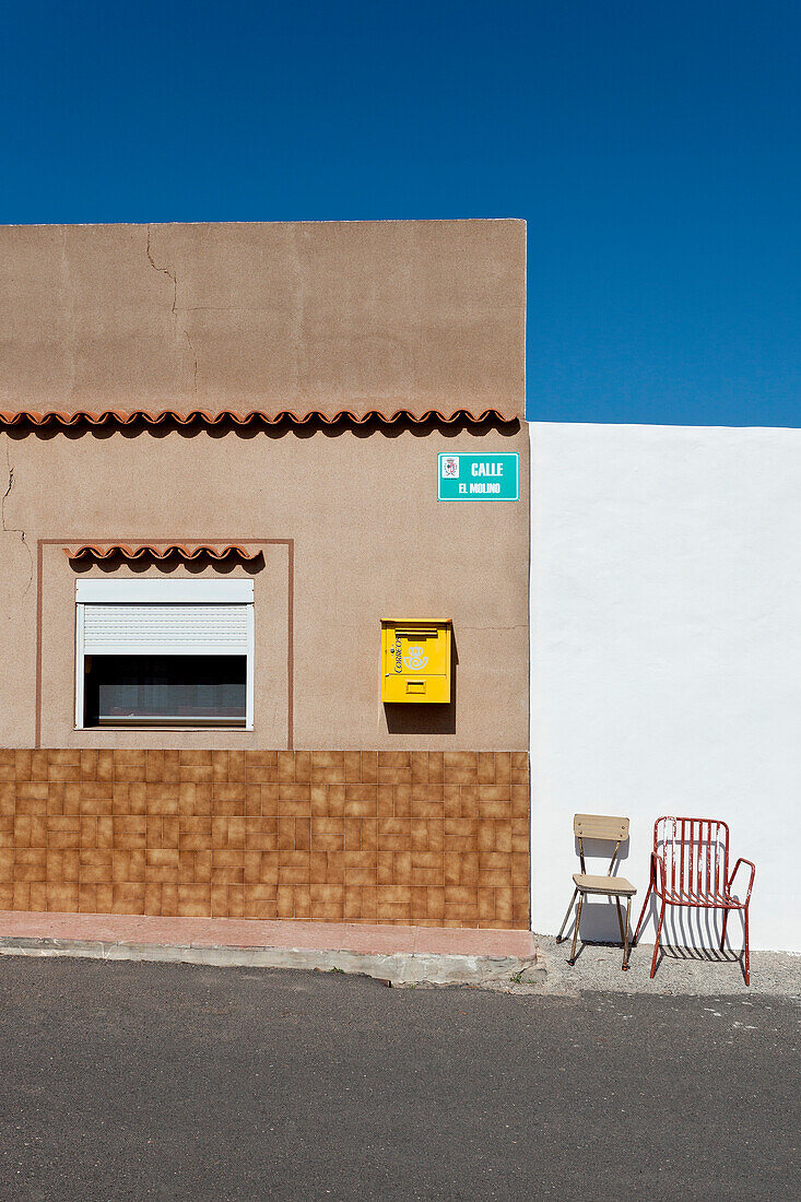 Letter box and chairs in front of a house, Antigua, Fuerteventura, Canary Islands, Spain