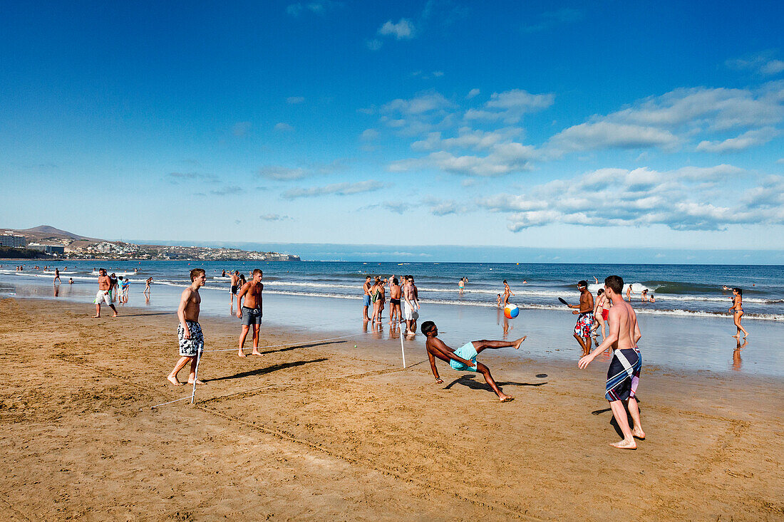 Playing football on the beach, Playa del Ingles, Gran Canaria, Canary Islands, Spain