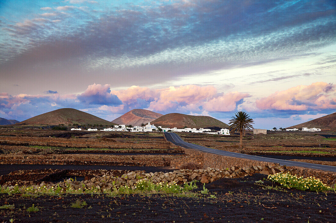 Village Mancha Blanca, Timanfaya National Park in the background, Lanzarote, Canary Islands, Spain, Europe