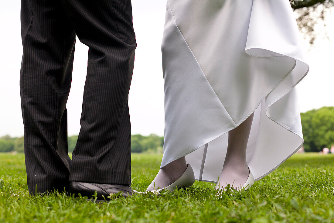 Legs of a wedding couple standing at the park, wedding, Leipzig, Saxony, Germany