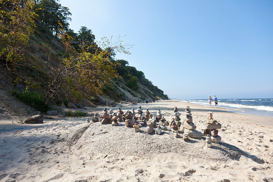 Row of stone men at the beach, cairns, cliff line, steep coast, bluffs, Baltic Sea, Bansin, Island Usedom, Mecklenburg West Pomerania, Germany