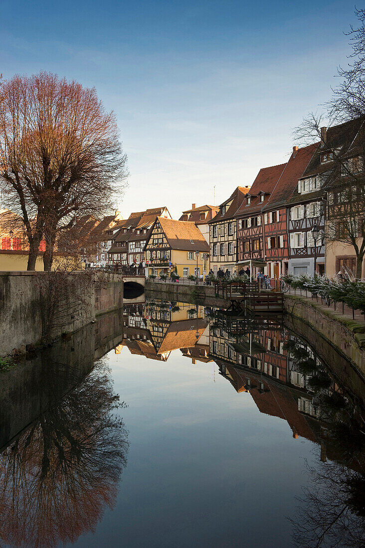 Reflection of half-timbered houses in the water, Historic quarter in winter, Colmar, Alsace, France