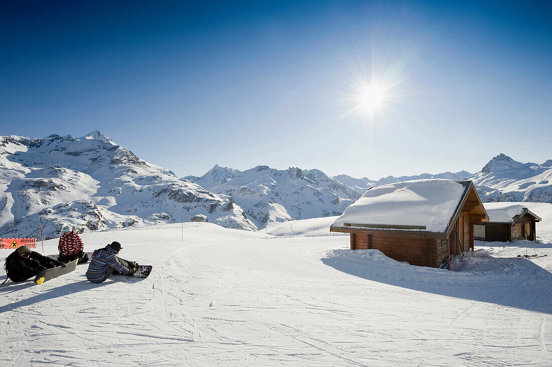 Snowboarders near a mountain hut, Tignes, Val d Isere, Savoie department, Rhone-Alpes, France