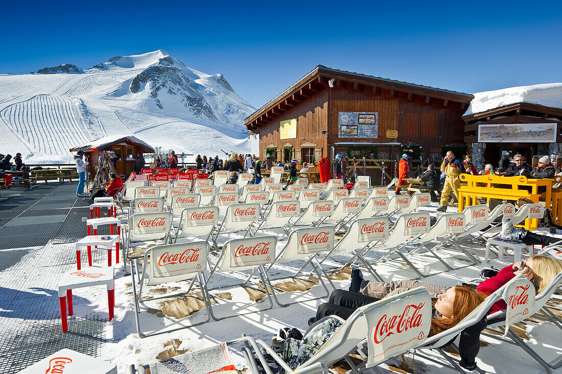 Deck chairs outside a mountain restaurant, Tignes, Val d Isere, Savoie department, Rhone-Alpes, France
