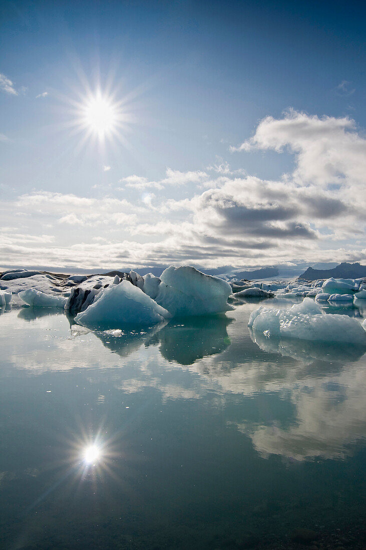 Reflection of the sky in the Jokulsarlon glacier lake, Iceland, Scandinavia, Europe