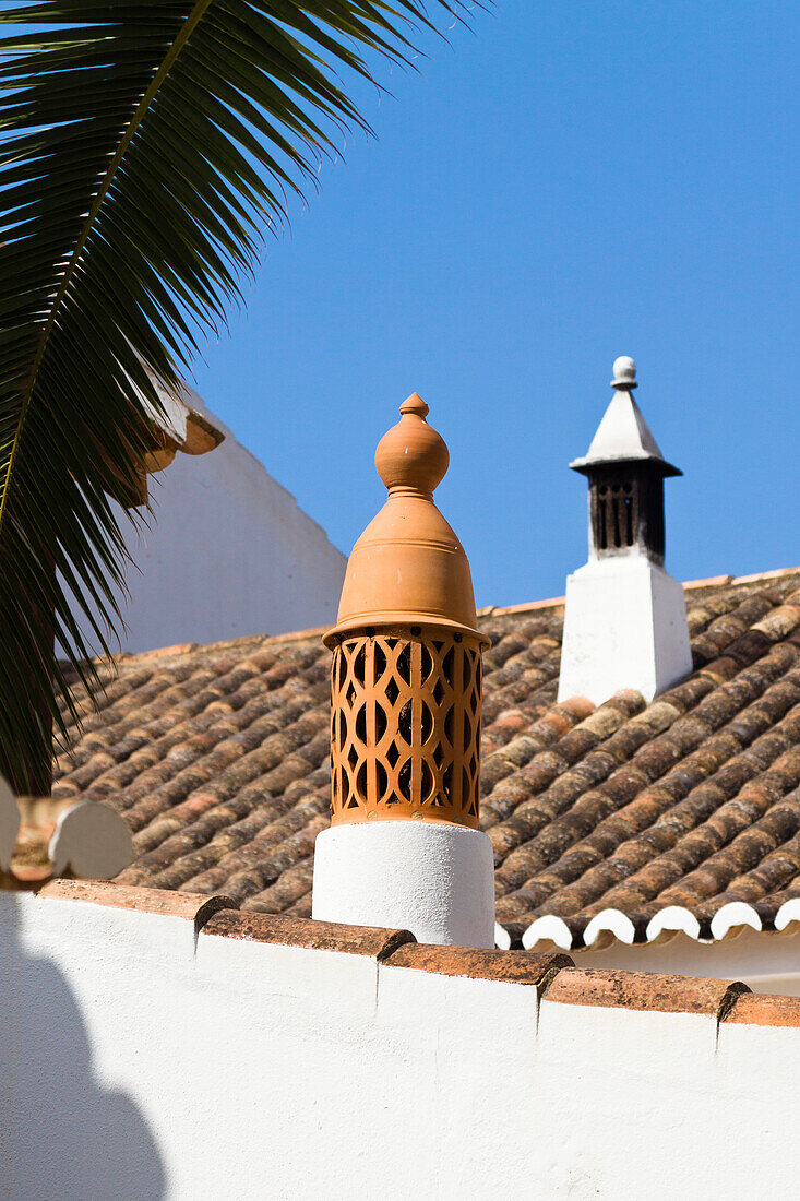 Chimneys on cottage, icon of the Algarve, Portugal, Europe