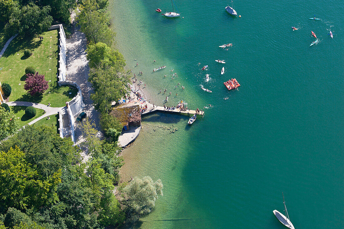 Aerial view of people bathing in lake Starnberg with sailing boats, Upper Bavaria, Bavaria, Germany