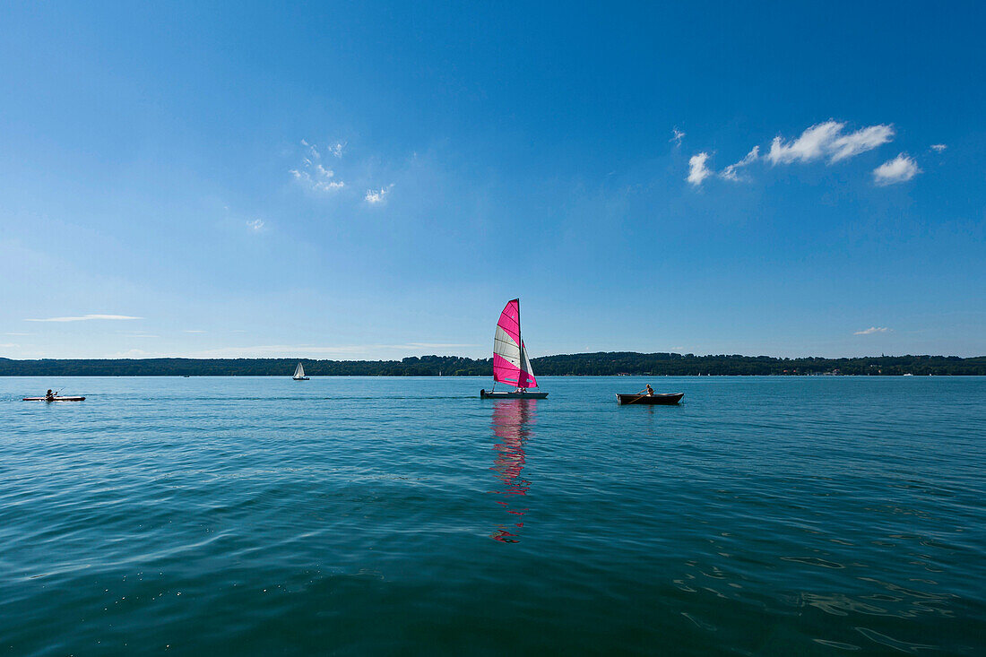 Catamaran, kayak and rowing boat on lake Starnberg, Upper Bavaria, Germany, Europe