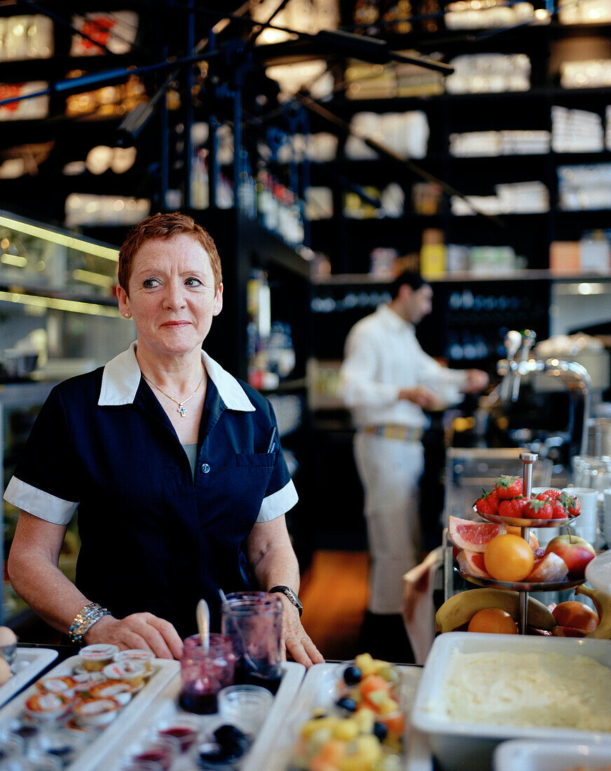 Waitress at the breakfast buffet in a hotel, Zeeburg, Amsterdam, Netherlands