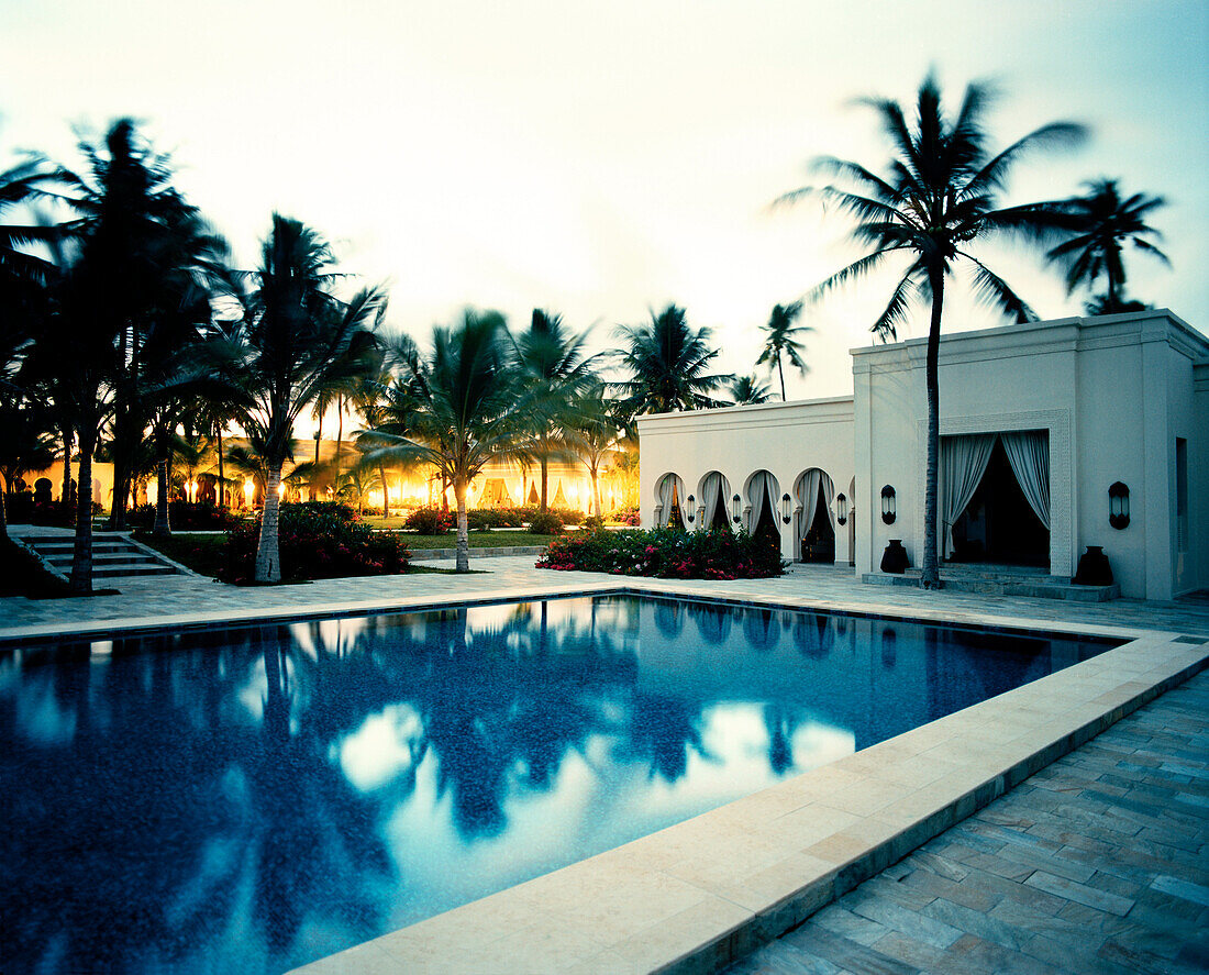 Courtyard with palm trees, Restaurant and Pool of Baraza Spa and Resort in Bwejuu, East Coast, Zanzibar, Tanzania, East Africa