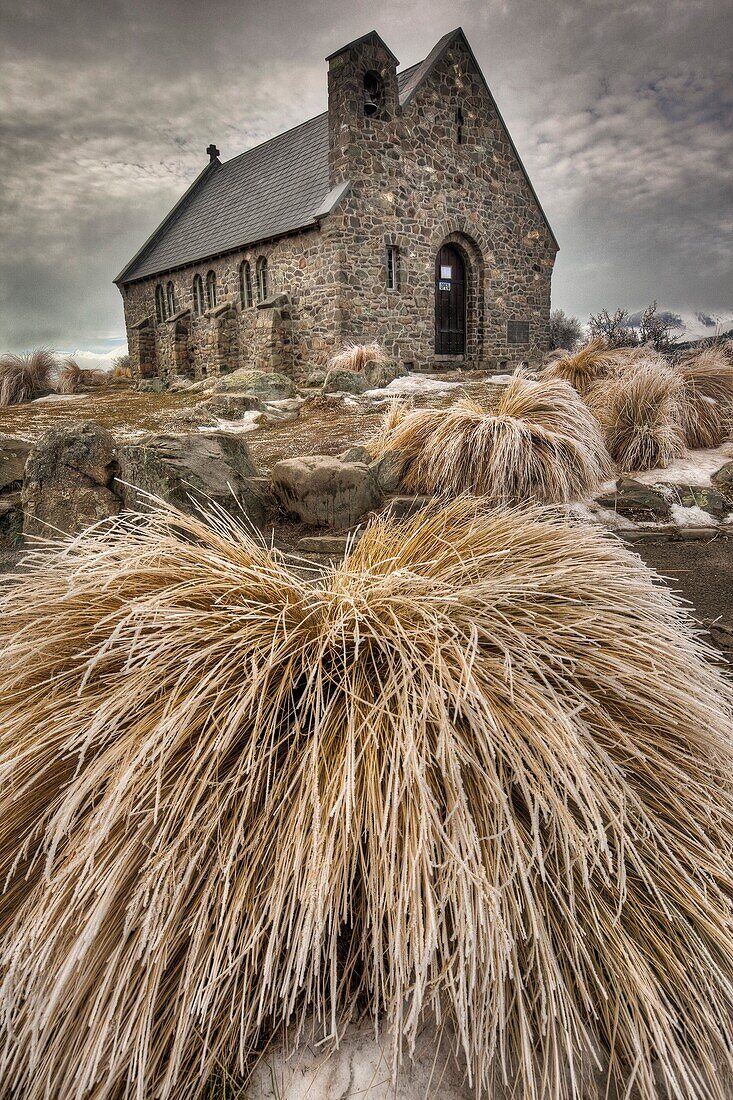 Church of the Good Shepherd, frosted tussock grass in winter, Lake Tekapo, Canterbury, New Zealand