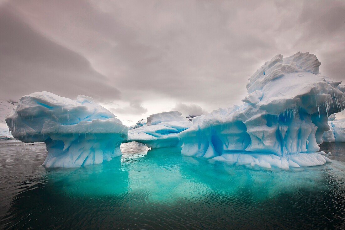 Stormy sky over iceberg, Pleneau Island, Antarctic Peninsula.