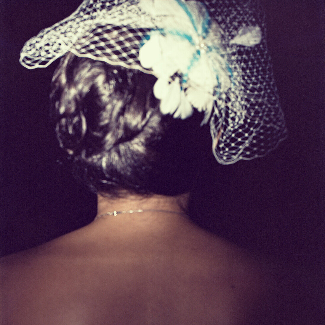 Woman Wearing Headpiece With Veil, Rear View