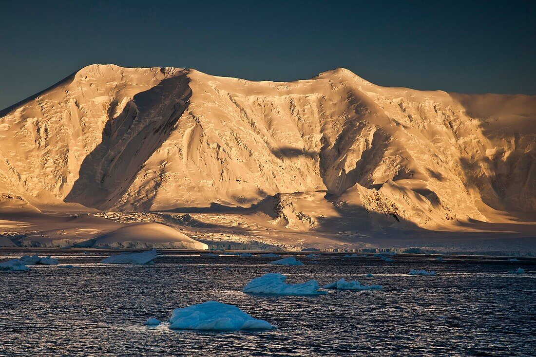 Mt Francais, 2825 metres, highest peak on Anvers Island, at sunset, Gerlache Strait, Antarctic Peninsula.