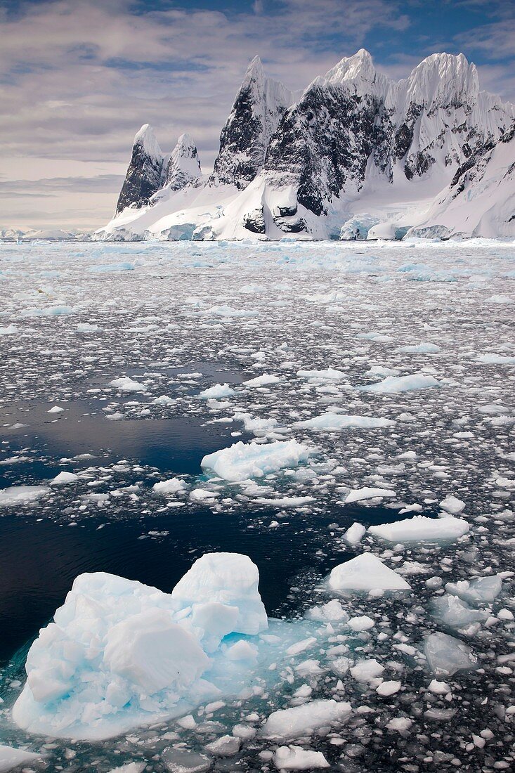 Cape Renard towers  Una´s Tits, brash ice fills Lemaire Channel, Antarctic Peninsula.