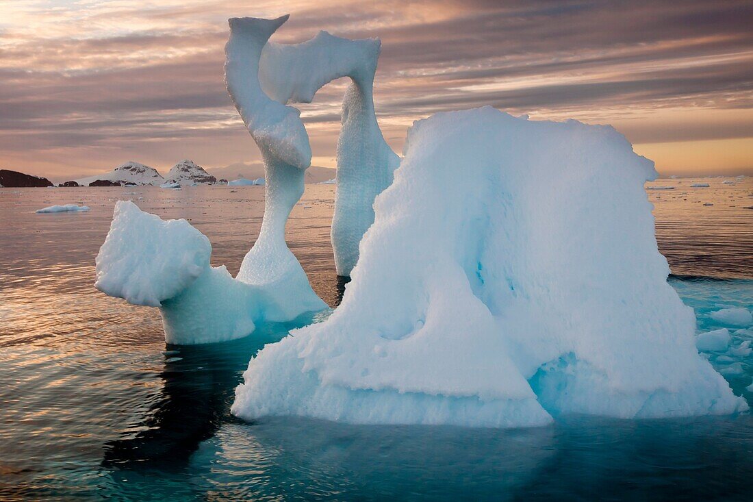 Iceberg with thin arch at sunset, Cierva Cove, Antarctic Peninsula.