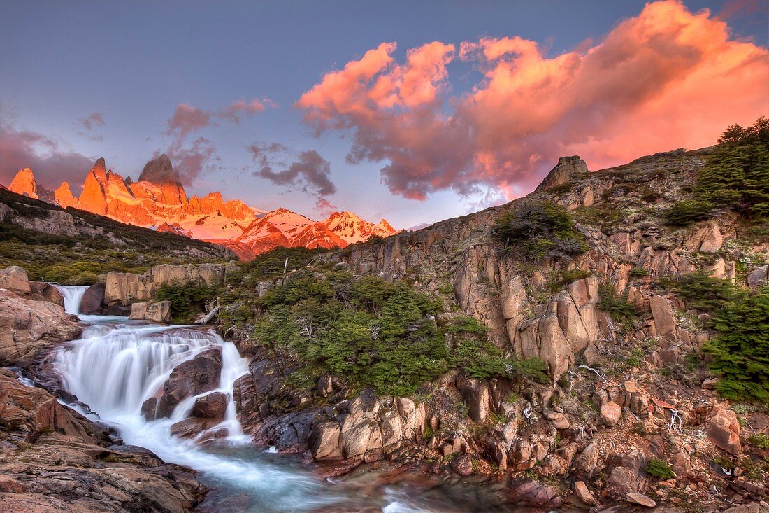 FitzRoy waterfall at dawn under famous rock peak Cerro FitzRoy  El Chalten, Parque Nacional Los Glaciares, Patagonia, Argentina
