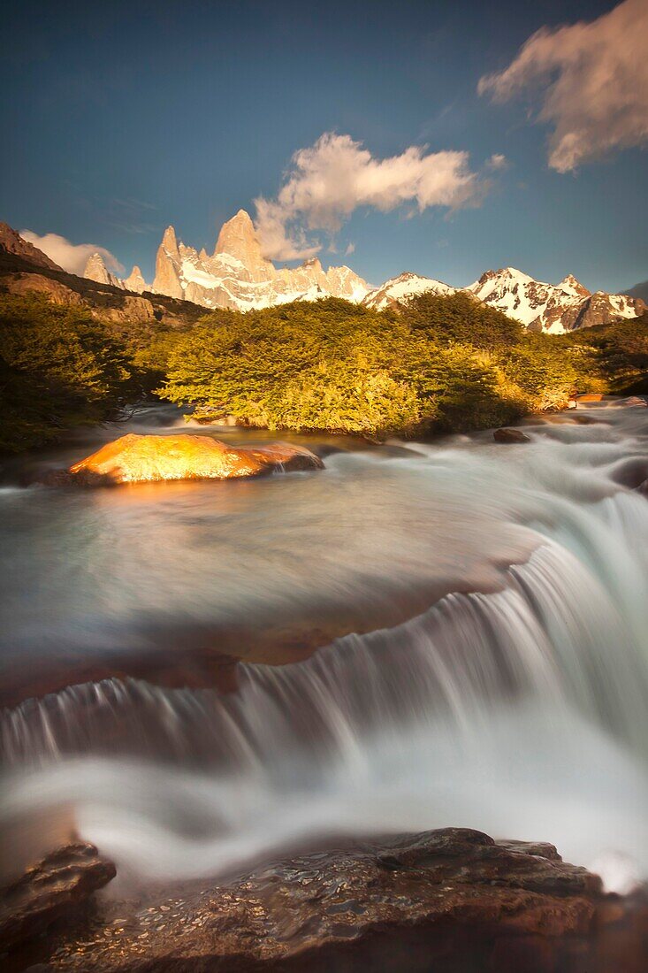 FitzRoy waterfall at dawn under famous rock peak Cerro FitzRoy  El Chalten, Parque Nacional Los Glaciares, Patagonia, Argentina