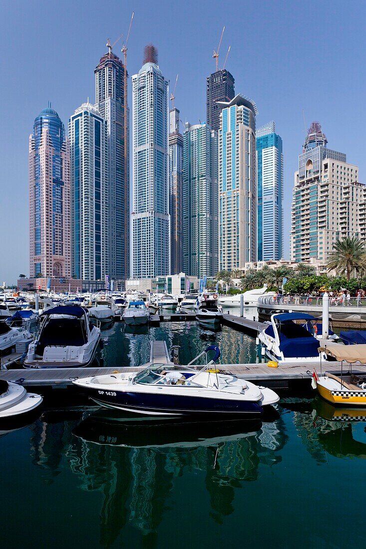 The Dubai Marina with high rise buildings and boats in Dubai, UAE, Persian Gulf