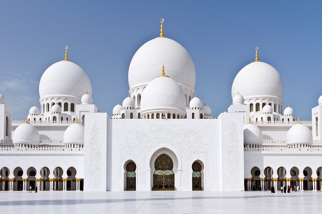 Exterior domes, arches and minarets of the the Sheikh Zayed Grand Mosque in Abu Dhabi, UAE