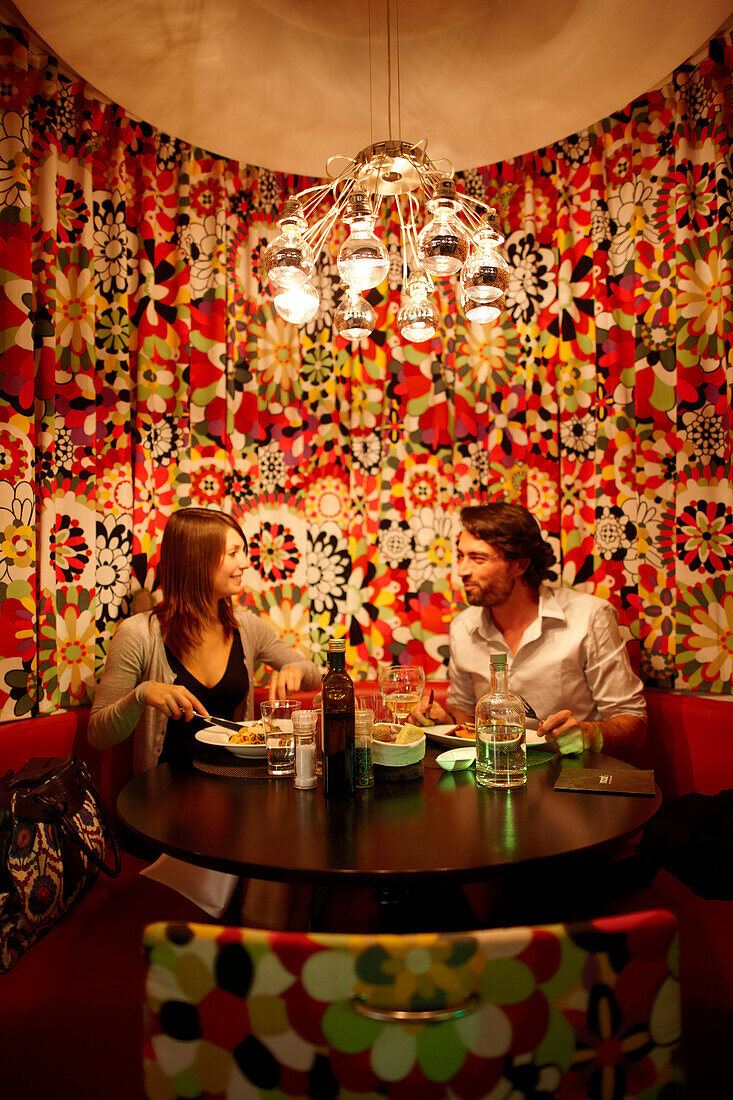 Couple inside hotel's on-site restaurant, Brussels, Belgium