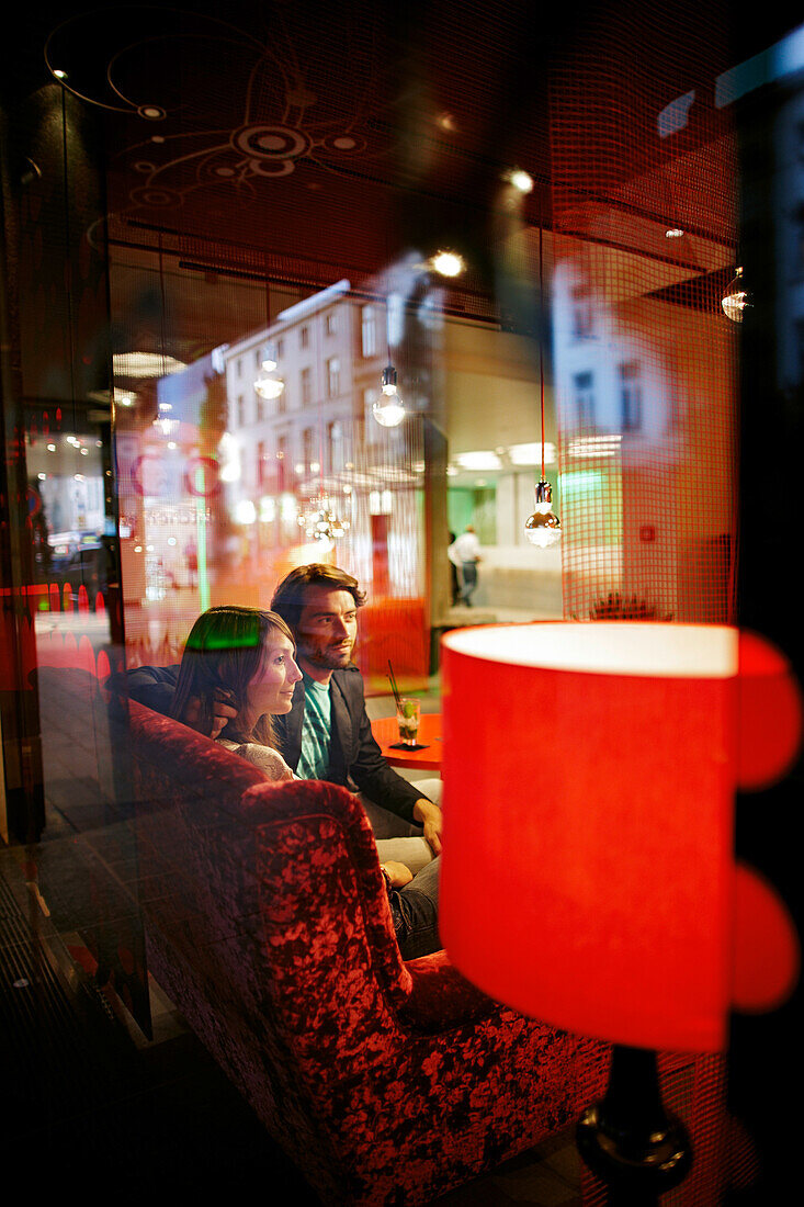 Couple inside hotel's on-site restaurant, Brussels, Belgium