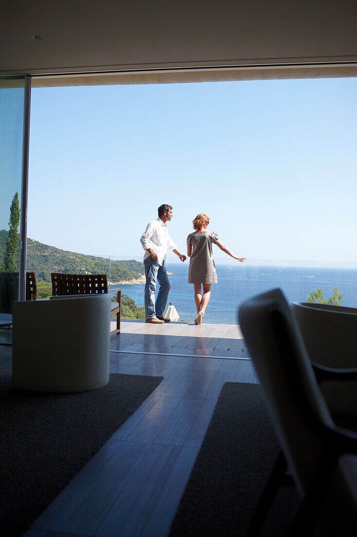 Couple standing on a hotel terrace, Ramatuelle, Provence-Alpes-Cote d'Azur, France
