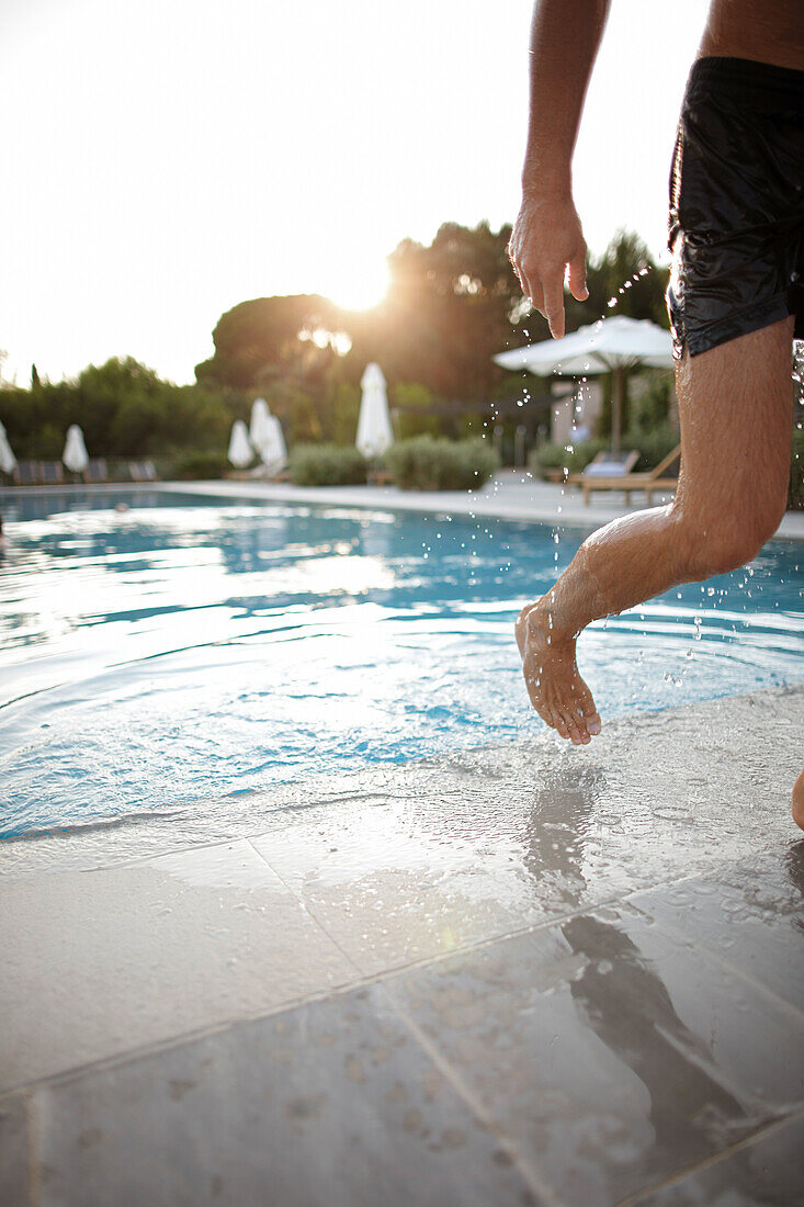 Man coming out of the pool, Hotel La Réserve Ramatuelle, Chemin de la Quessine, Ramatuelle, France