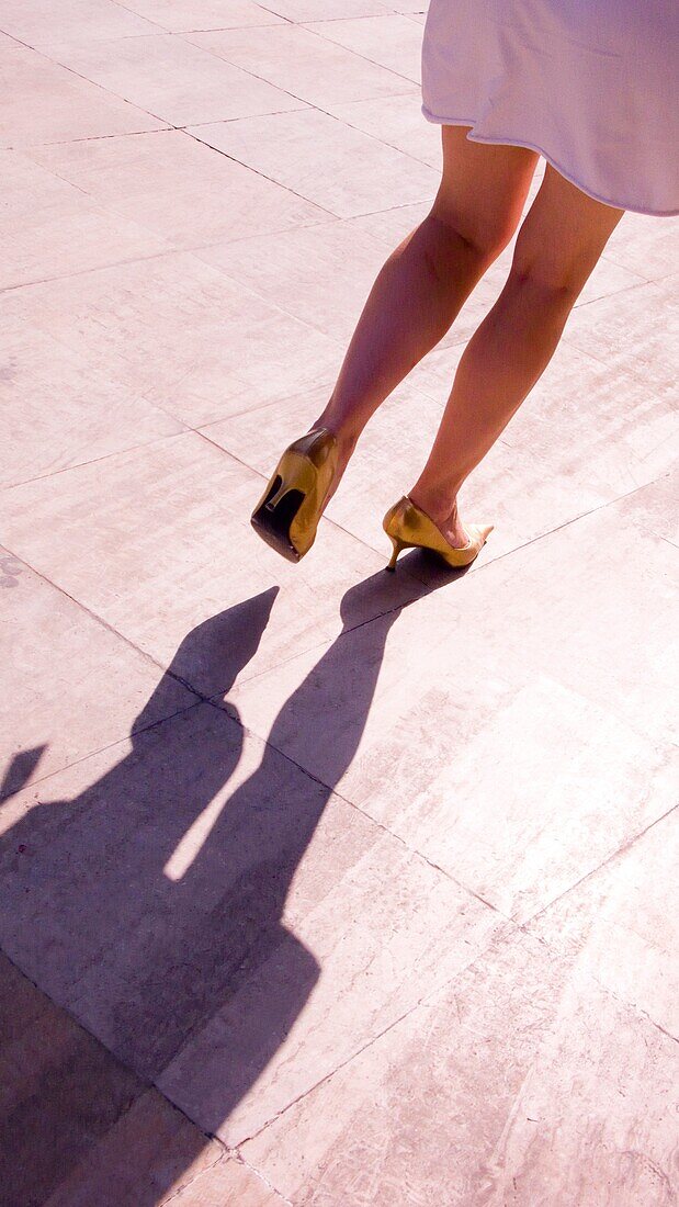 Woman with golden shoes