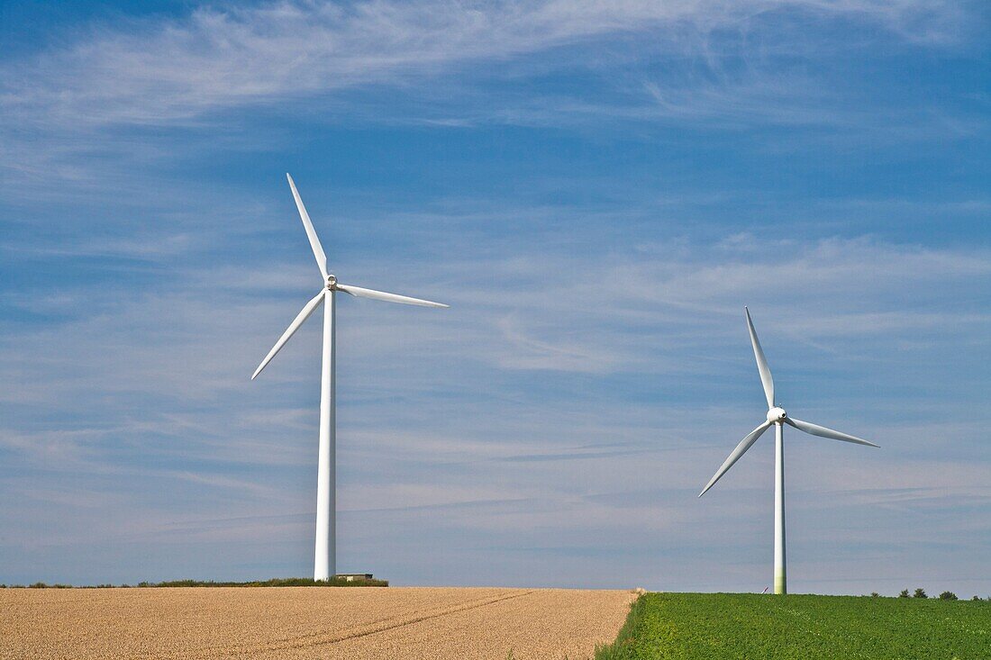 Two wind generators on a field in Lower Saxony, Germany, Europe