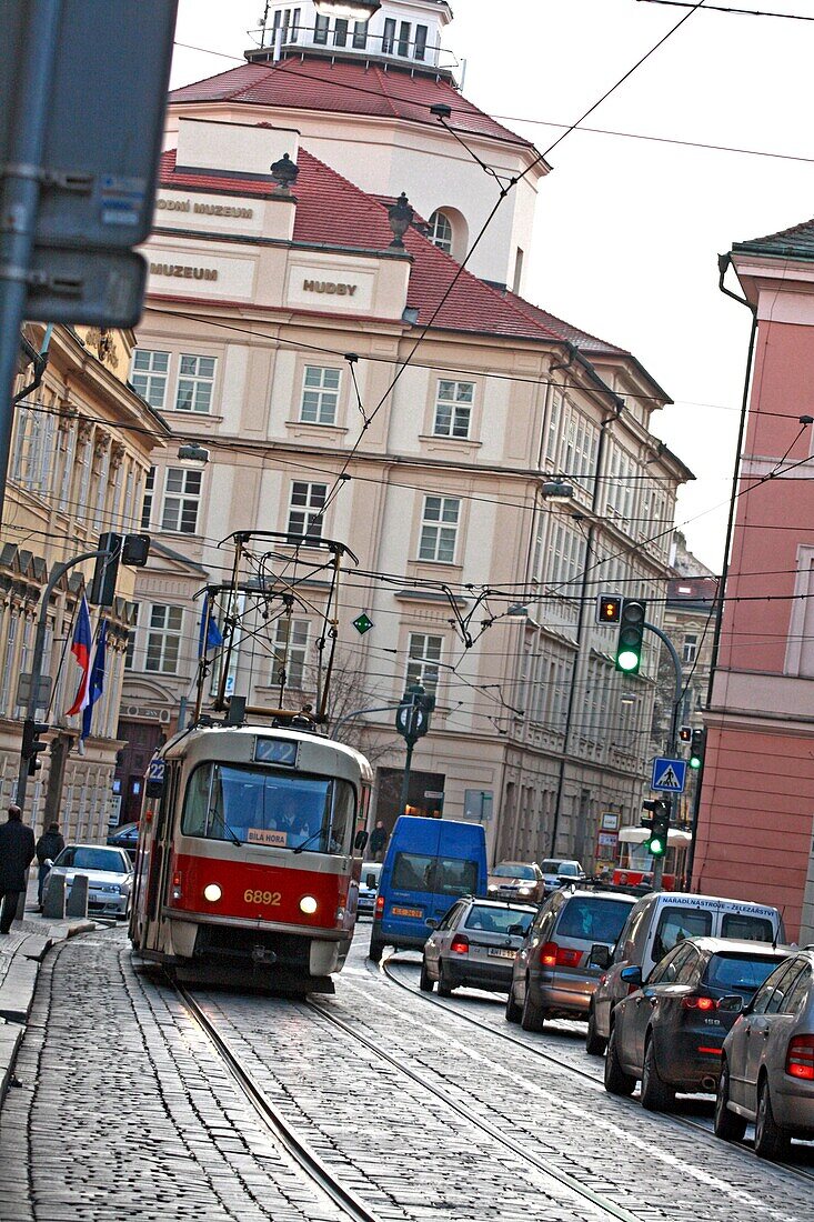 Karmelitska Street, Prague  Tram 22 grinds down a busy karmelitska street into Malostranske namesti on a cloudy November day  Museum of Music History in background  Prague, Czech Republic