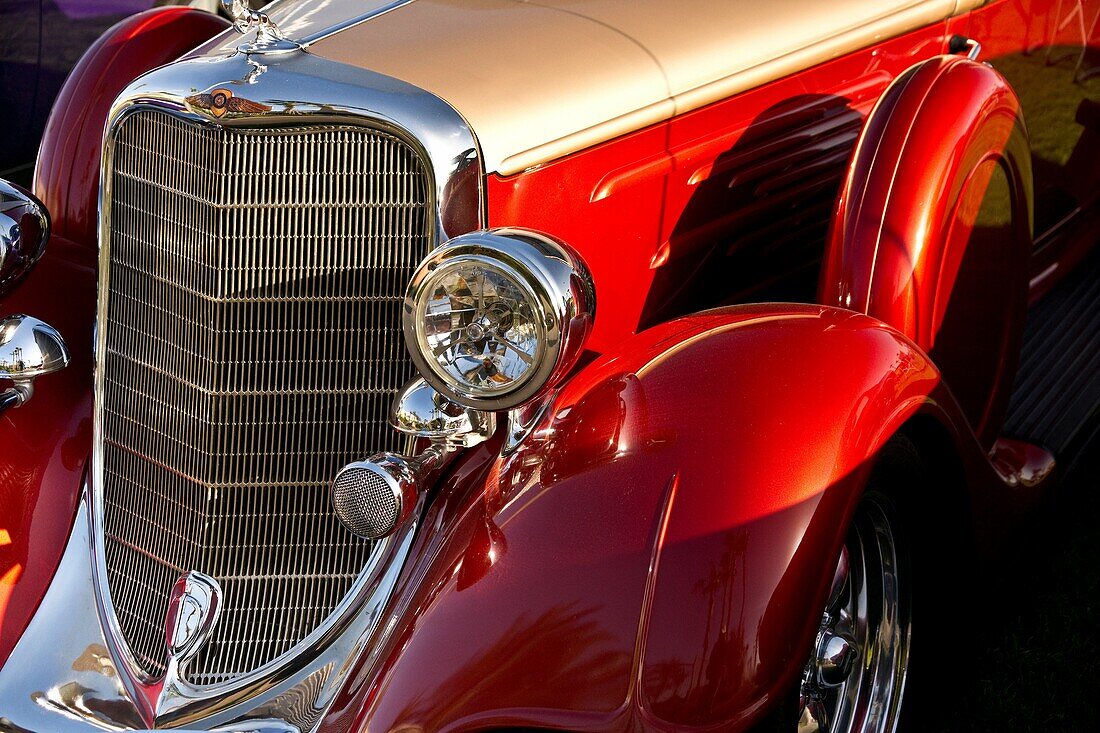 Close-up of left front quarter fender, grille and headlamps of a classic car