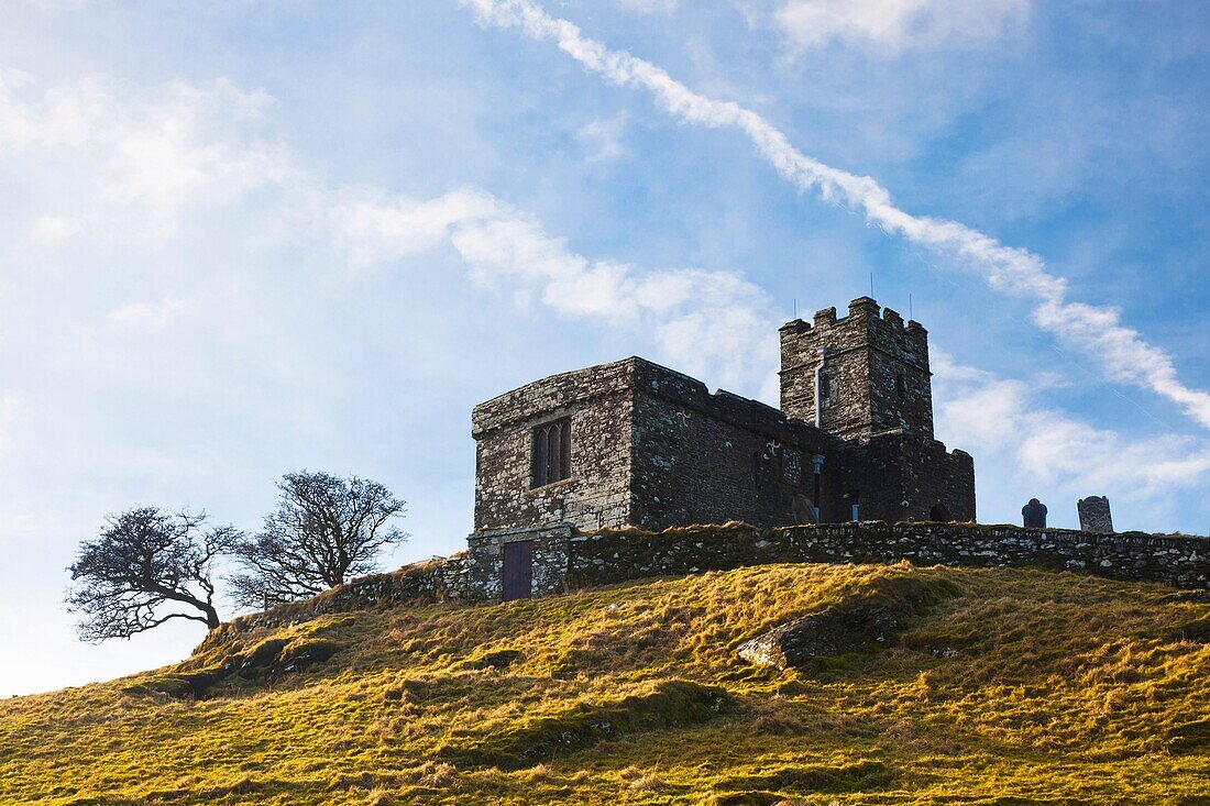 Looking up at the Church of St Micheal de Rupe on Brentor, Dartmoor Devon England UK