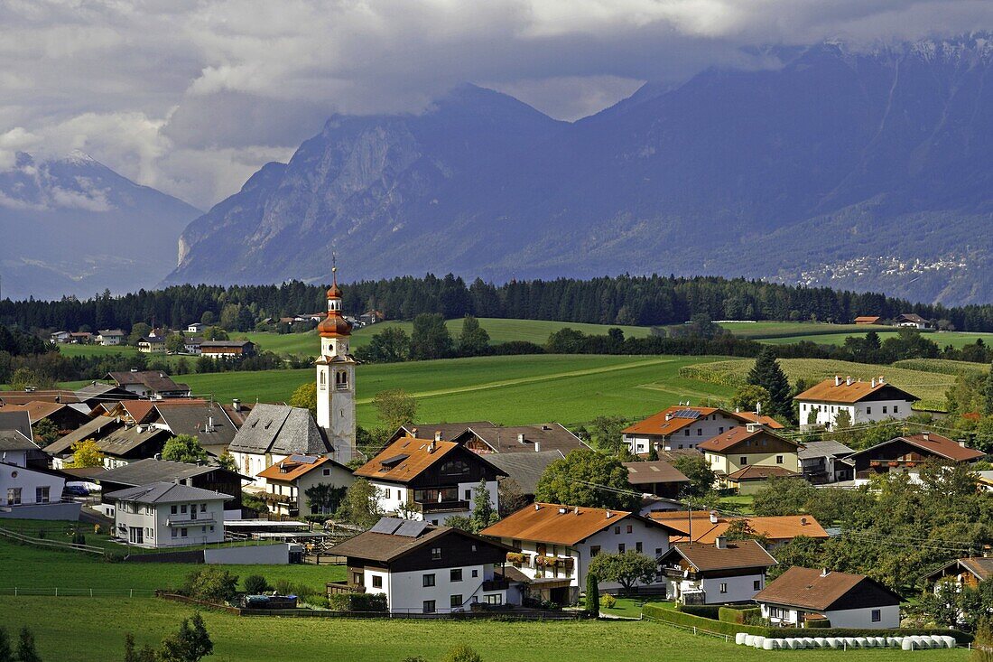 Austria Tirol Tyrol Tulfs small town church steeple mountain high road pastoral landscape