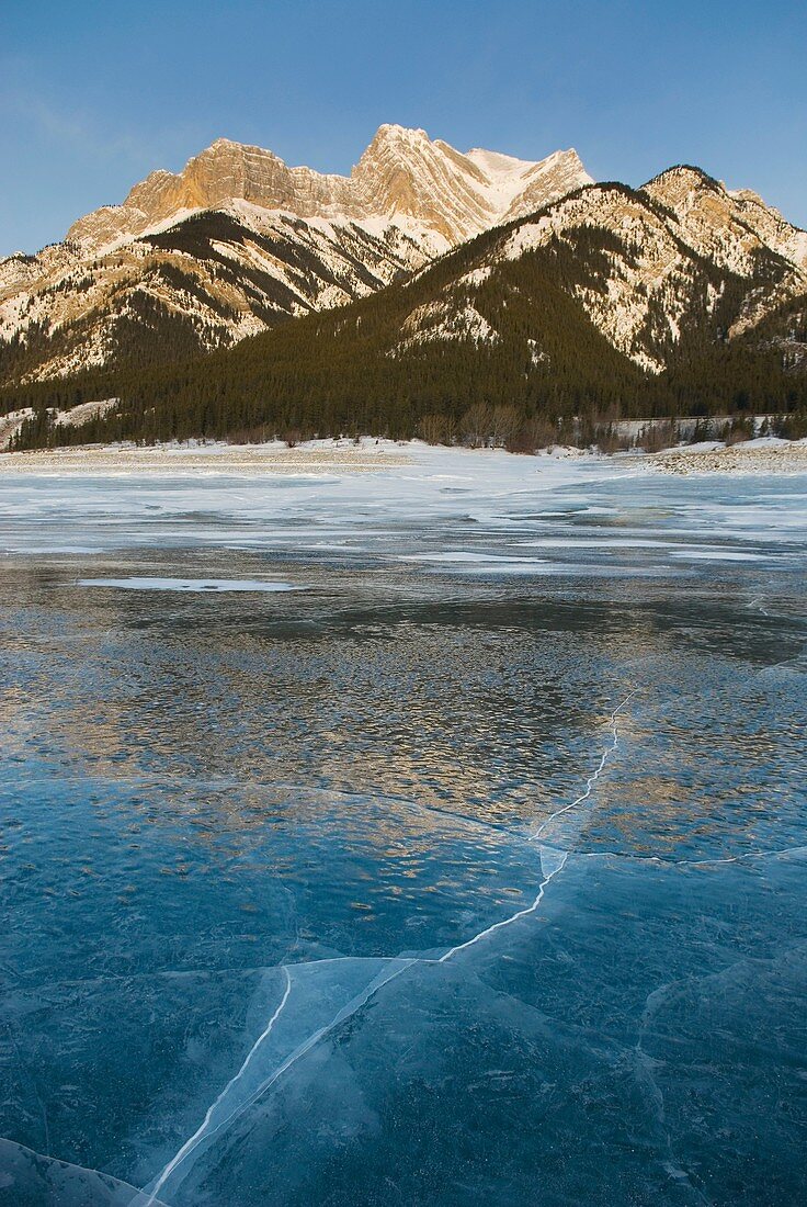 Sunrise over the wind blasted surface of Abraham Lake, Alberta Canada