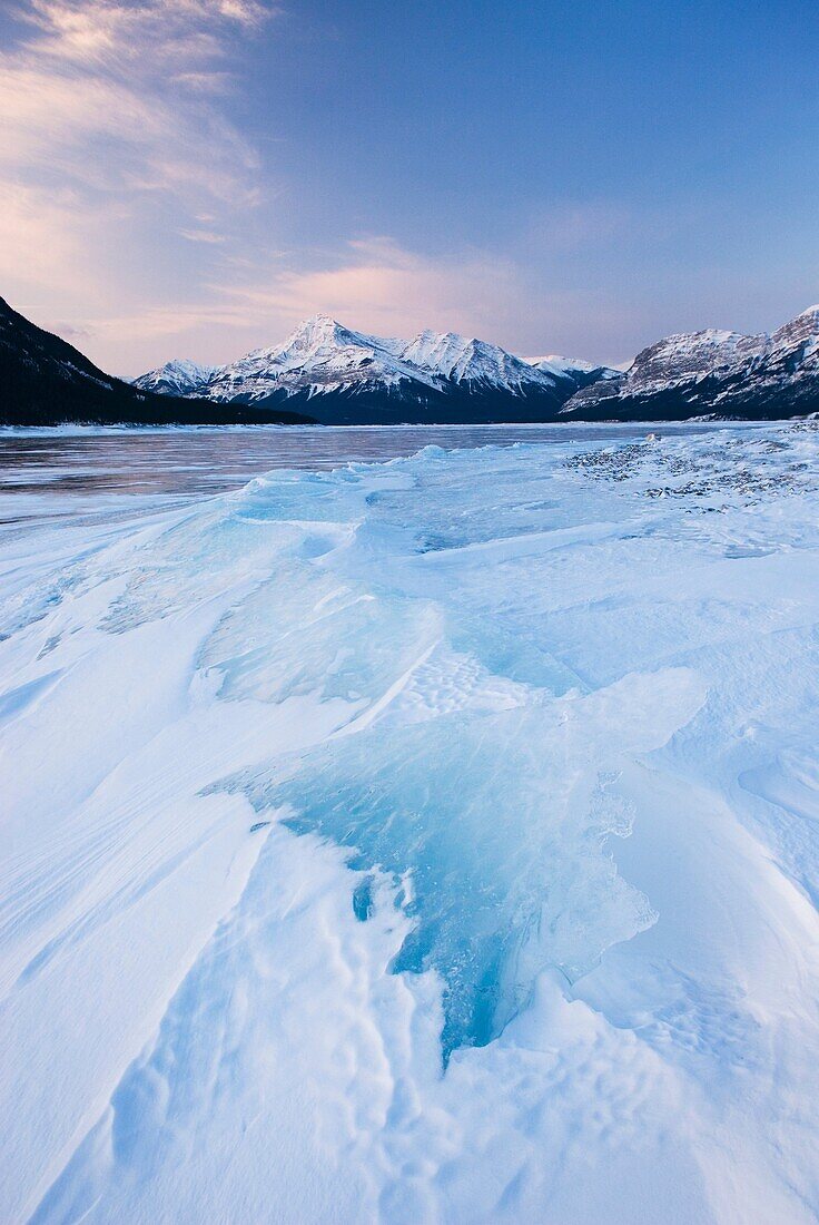 Daybreak over the wind blasted surface of Abraham Lake, Alberta Canada